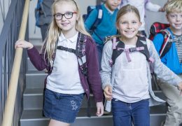 happy-pupils-on-staircase-leaving-school-2024-09-15-17-48-08-utc